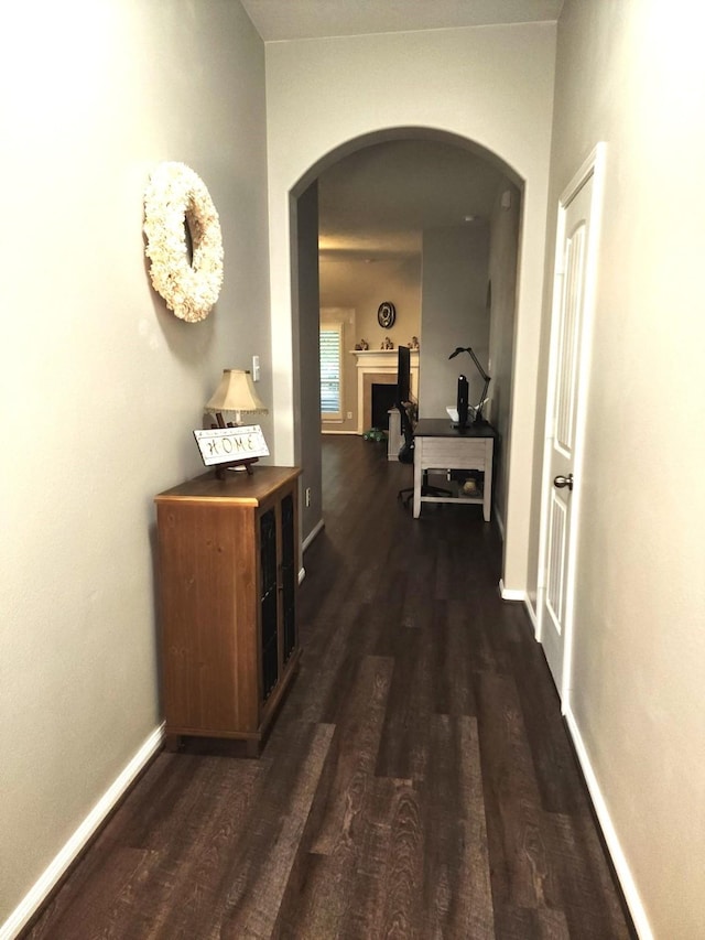 3514 Tulip Trace Dr, Spring, TX 77386 - hallway with arched walkways and dark wood-style floors