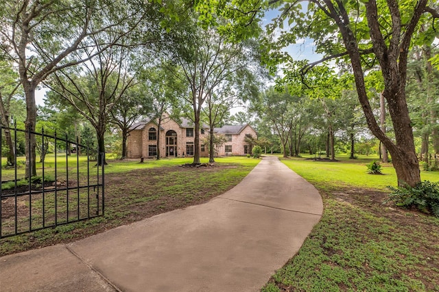 1019 Towering Oaks St, Magnolia, TX 77355 - view of property's community with a lawn