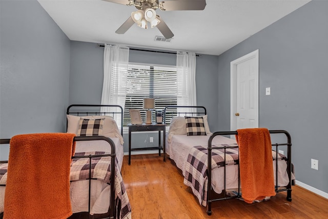 1019 Towering Oaks St, Magnolia, TX 77355 - bedroom featuring wood finished floors and a ceiling fan