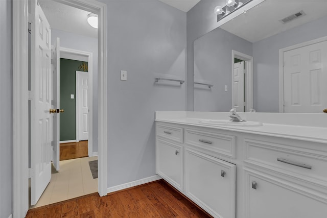 1019 Towering Oaks St, Magnolia, TX 77355 - bathroom featuring vanity and wood finished floors