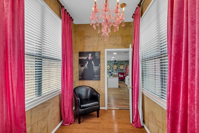 1019 Towering Oaks St, Magnolia, TX 77355 - living area featuring a chandelier and wood finished floors