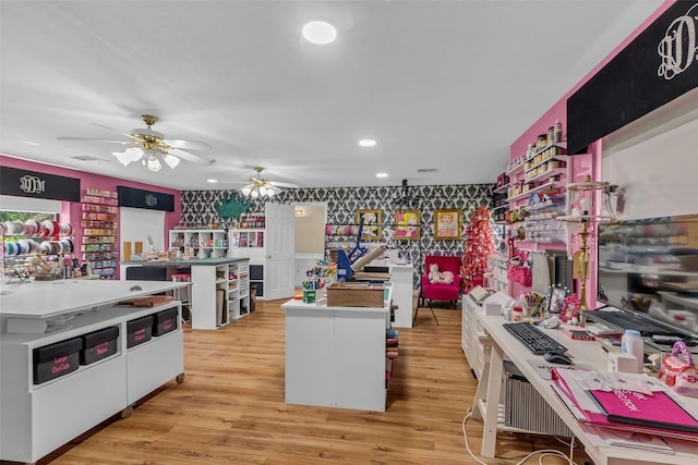 1019 Towering Oaks St, Magnolia, TX 77355 - kitchen with ceiling fan, a center island, wallpapered walls, light wood finished floors, and recessed lighting