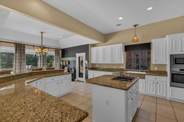 1019 Towering Oaks St, Magnolia, TX 77355 - kitchen with appliances with stainless steel finishes, light tile patterned floors, white cabinetry, and recessed lighting