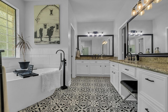 1019 Towering Oaks St, Magnolia, TX 77355 - full bath with vanity, a freestanding tub, and tile walls