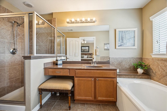 11014 Bakerwood Dr, Houston, TX 77064 - full bath with a stall shower, vanity, a garden tub, and tile patterned floors