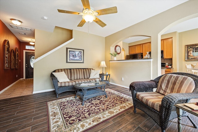 11014 Bakerwood Dr, Houston, TX 77064 - living area with a ceiling fan, dark wood-type flooring, and arched walkways