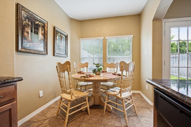 11014 Bakerwood Dr, Houston, TX 77064 - dining room featuring light tile patterned floors and a textured wall