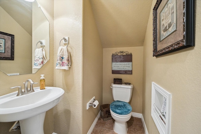 11014 Bakerwood Dr, Houston, TX 77064 - bathroom featuring lofted ceiling and tile patterned floors
