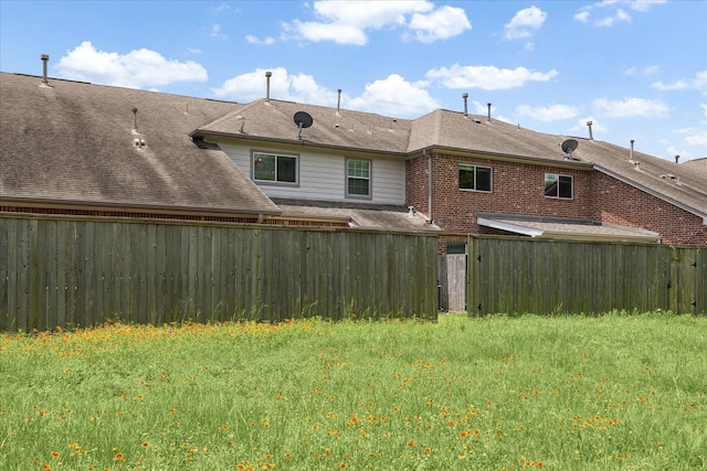 11014 Bakerwood Dr, Houston, TX 77064 - back of property featuring a fenced backyard and brick siding