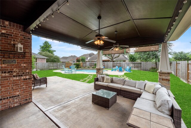 12415 Bunker Cove Dr, Cypress, TX 77433 - fenced backyard featuring an outdoor living space, a patio area, and ceiling fan