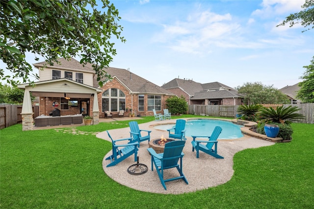12415 Bunker Cove Dr, Cypress, TX 77433 - view of swimming pool with an outdoor living space with a fire pit, a patio, and a fenced backyard