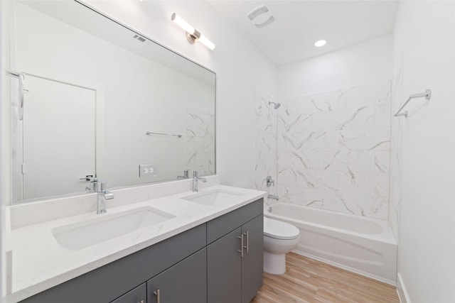2103 Holman, Houston, TX 77004 - bathroom with double vanity, wood finished floors, and bathing tub / shower combination