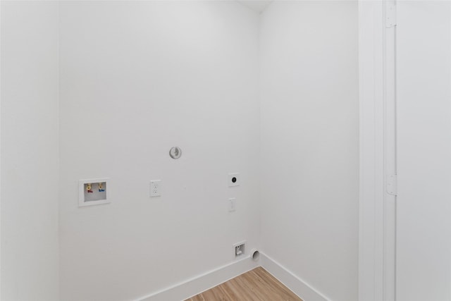 2103 Holman, Houston, TX 77004 - washroom with electric dryer hookup, hookup for a washing machine, light wood-type flooring, and hookup for a gas dryer
