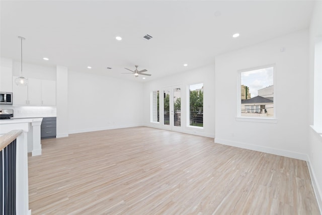 2103 Holman, Houston, TX 77004 - unfurnished living room featuring ceiling fan, recessed lighting, and light wood-type flooring