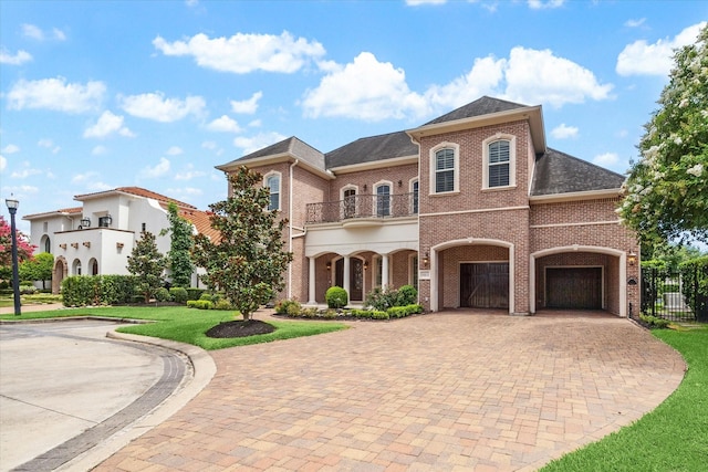 15611 Oyster Cove Dr, Sugar Land, TX 77478 - view of front of home with brick siding, a balcony, decorative driveway, and roof with shingles