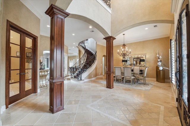 15611 Oyster Cove Dr, Sugar Land, TX 77478 - foyer entrance featuring arched walkways, ornate columns, french doors, recessed lighting, and crown molding