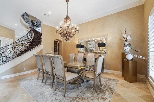 15611 Oyster Cove Dr, Sugar Land, TX 77478 - dining area with arched walkways, stairs, crown molding, a chandelier, and recessed lighting