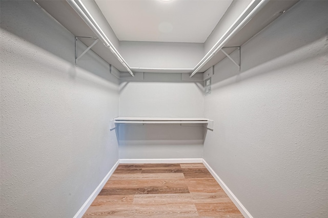 2110 Wilcrest Dr Unit 140, Houston, TX 77042 - walk in closet featuring wood finished floors