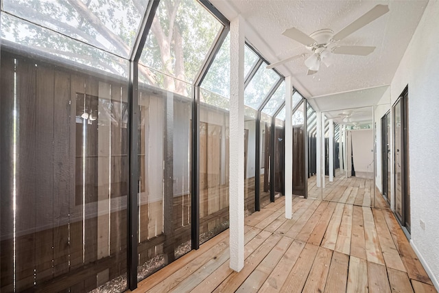 2110 Wilcrest Dr Unit 140, Houston, TX 77042 - unfurnished sunroom with ceiling fan, a textured ceiling, hardwood / wood-style floors, and a textured wall