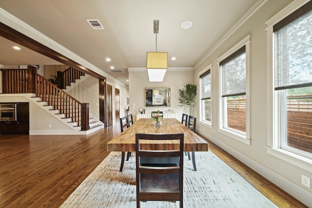 959 W 42nd St, Houston, TX 77018 - dining room featuring wood finished floors, ornamental molding, stairs, and recessed lighting