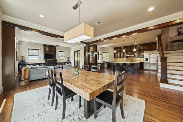959 W 42nd St, Houston, TX 77018 - dining area with ornamental molding, stairway, plenty of natural light, recessed lighting, and dark wood-style floors