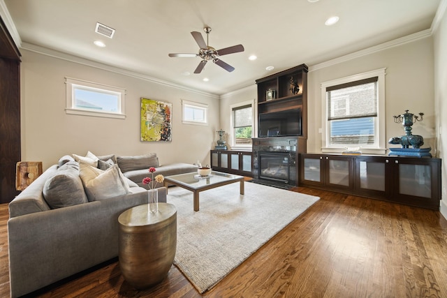 959 W 42nd St, Houston, TX 77018 - living area featuring wood finished floors, a ceiling fan, ornamental molding, recessed lighting, and a fireplace