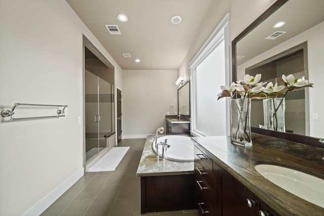 959 W 42nd St, Houston, TX 77018 - bathroom with two vanities, a shower stall, recessed lighting, a bath, and tile patterned flooring