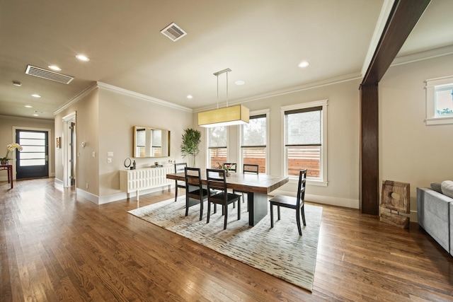 959 W 42nd St, Houston, TX 77018 - dining room with ornamental molding, recessed lighting, and dark wood-style flooring
