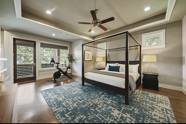 959 W 42nd St, Houston, TX 77018 - bedroom featuring wood finished floors, recessed lighting, a raised ceiling, and access to exterior