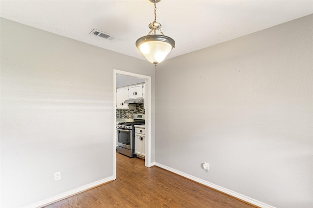 14 Sarita Rd, Angleton, TX 77515 - empty room with wood finished floors and baseboards