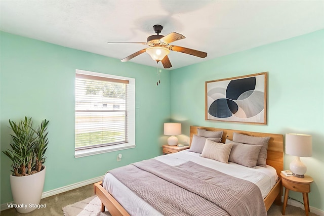 14 Sarita Rd, Angleton, TX 77515 - carpeted bedroom with baseboards and a ceiling fan