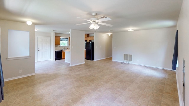25531 Black St, Splendora, TX 77372 - unfurnished room featuring a ceiling fan and baseboards