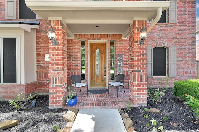 5806 Wilton St, Pearland, TX 77584 - property entrance with brick siding and a porch