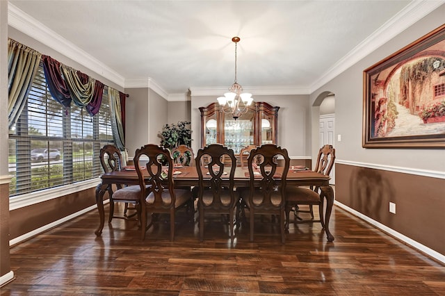 5806 Wilton St, Pearland, TX 77584 - dining space with a chandelier, arched walkways, crown molding, and wood finished floors