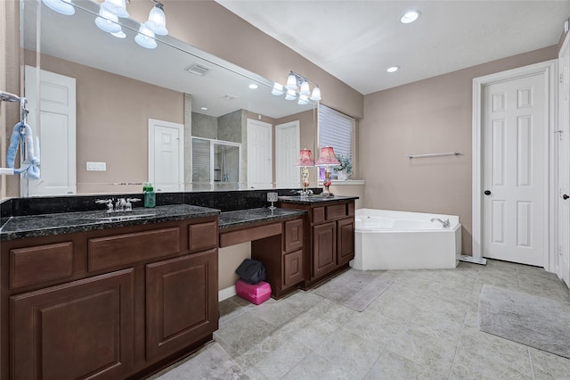 5806 Wilton St, Pearland, TX 77584 - bathroom featuring a shower stall, double vanity, a bath, recessed lighting, and tile patterned floors