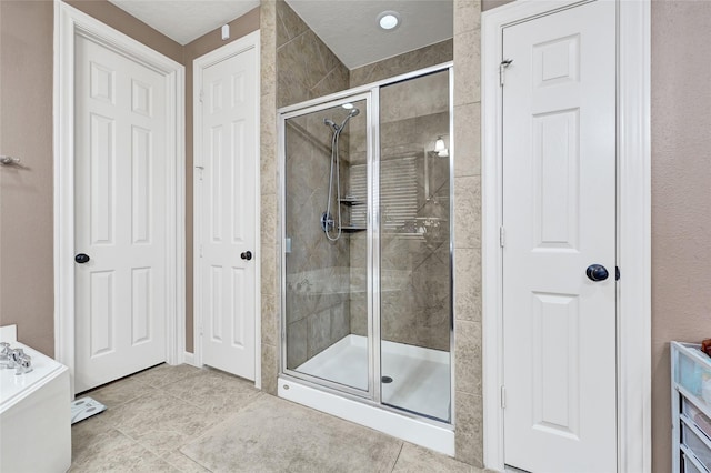 5806 Wilton St, Pearland, TX 77584 - full bath featuring a shower stall, tile patterned floors, and a bath