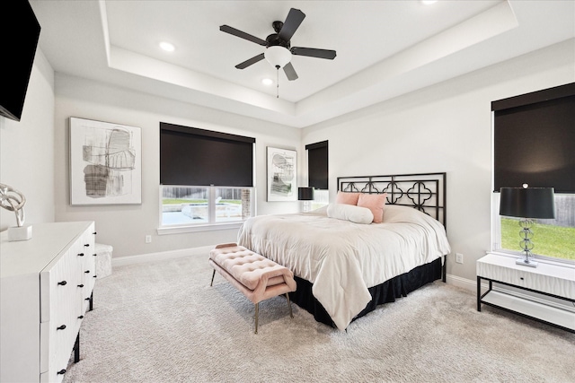 508 Buckhorn St, Sealy, TX 77474 - bedroom featuring a tray ceiling, carpet floors, recessed lighting, and ceiling fan