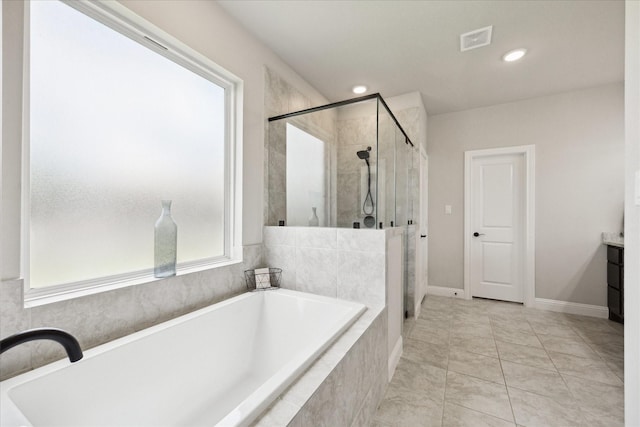 508 Buckhorn St, Sealy, TX 77474 - full bathroom with a garden tub, a shower stall, vanity, and recessed lighting