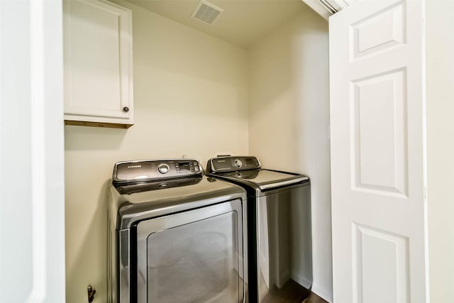 6219 Summerville Ln, Houston, TX 77041 - washroom with cabinet space and washing machine and clothes dryer