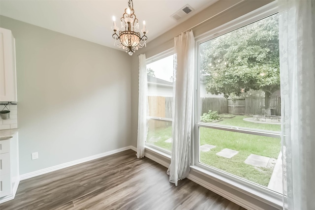 6219 Summerville Ln, Houston, TX 77041 - unfurnished dining area featuring a chandelier and wood finished floors