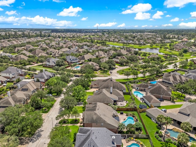 12815 Mimosa Spring Dr, Tomball, TX 77377 - aerial perspective of suburban area featuring a pool and a nearby body of water