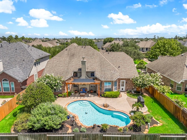 12815 Mimosa Spring Dr, Tomball, TX 77377 - view of swimming pool with a patio area, a fenced backyard, and a residential view