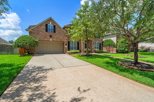 12815 Mimosa Spring Dr, Tomball, TX 77377 - traditional-style home featuring driveway, brick siding, and a garage