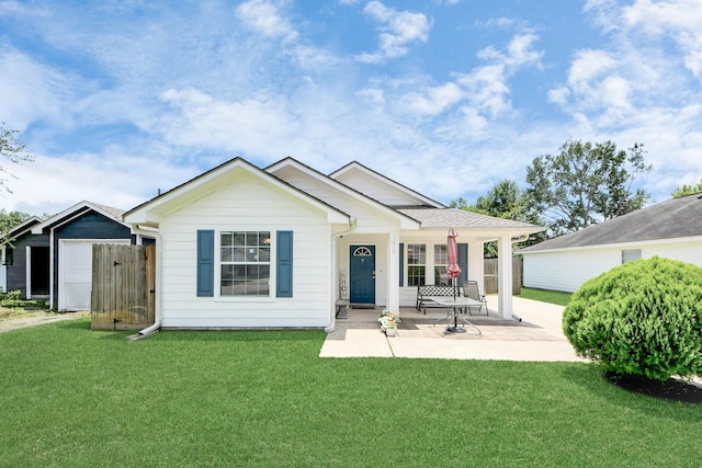 1214 Robert St, Baytown, TX 77521 - rear view of house with a yard