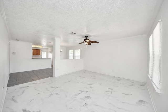 1214 Robert St, Baytown, TX 77521 - unfurnished living room featuring ceiling fan and a textured ceiling