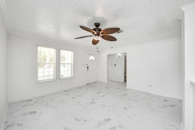 1214 Robert St, Baytown, TX 77521 - unfurnished living room with ceiling fan, crown molding, a textured ceiling, and light marble finish floors
