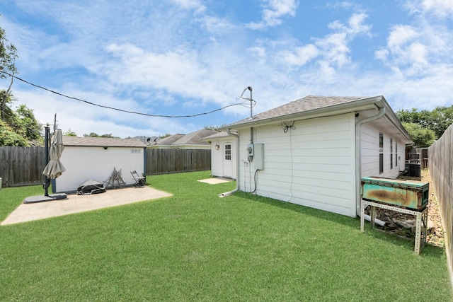 1214 Robert St, Baytown, TX 77521 - fenced backyard with a patio