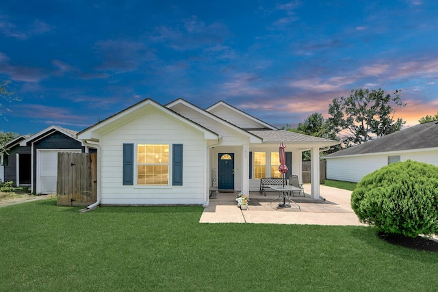 1214 Robert St, Baytown, TX 77521 - back of property with a lawn and covered porch