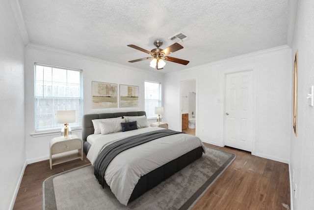 1214 Robert St, Baytown, TX 77521 - bedroom featuring a textured ceiling, crown molding, wood finished floors, connected bathroom, and ceiling fan