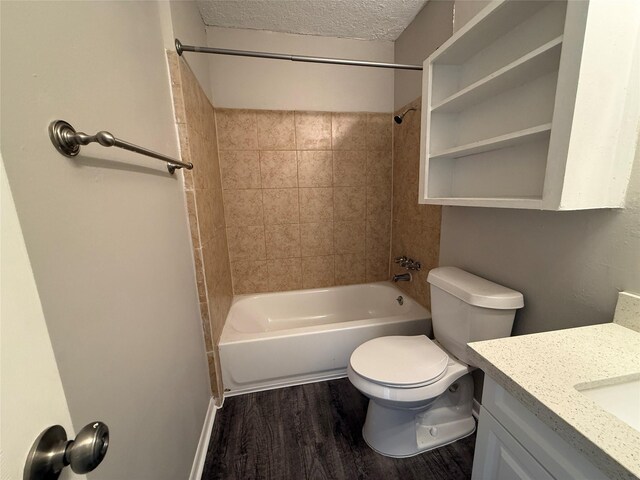 3616 Longwood Dr, Pasadena, TX 77503 - bathroom with  shower combination, vanity, wood finished floors, and a textured ceiling